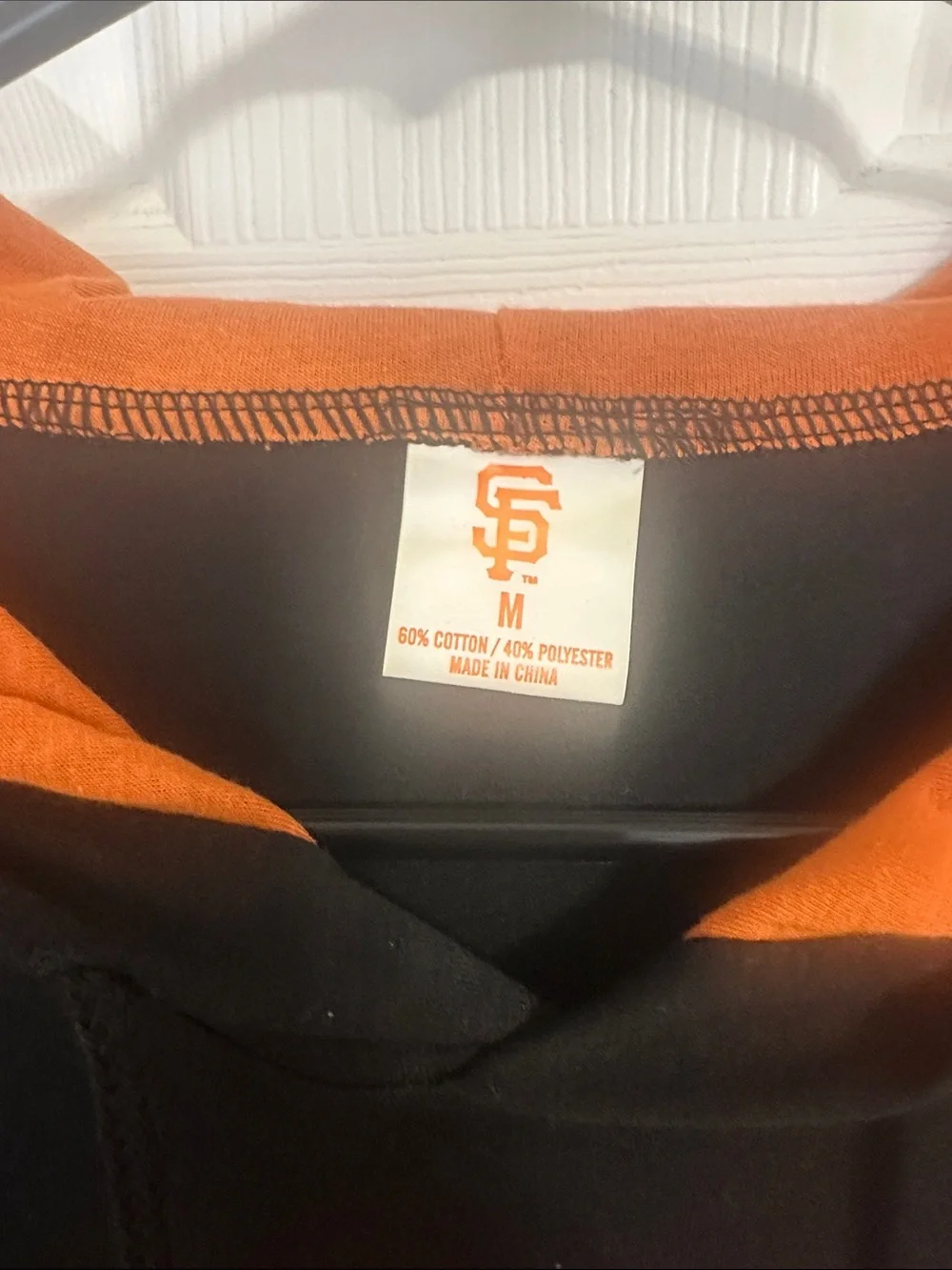 Black & Orange San Francisco Giants long sleeve hooded shirt. NWOT